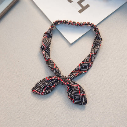 Big bow tie bunny ears headband with playful rabbit ears and oversized bow design