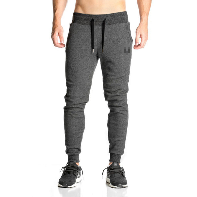 Running training pants displayed flat, showing their athletic design and comfortable fit