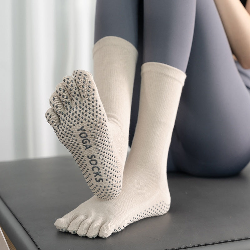 Women's mid-calf winter yoga socks with non-slip soles, gray and black striped design