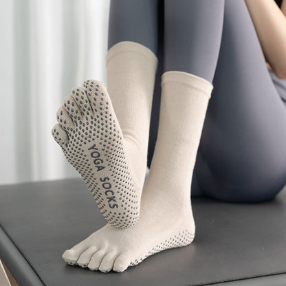 Women's mid-calf winter yoga socks with non-slip soles, gray and black striped design