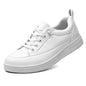 White Xinshdi Women's Non-Slip Service Shoes by BACKUPMYFILESNOW® with a clean design and slip-resistant soles.