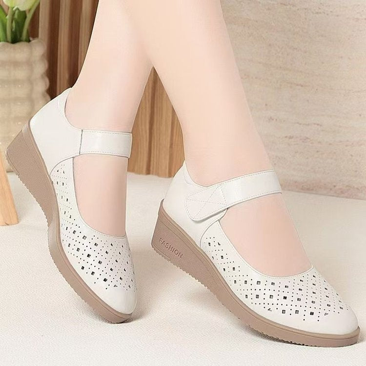 Women's wedge-heeled sandals with soft sole and soft upper, shown in a simple product view