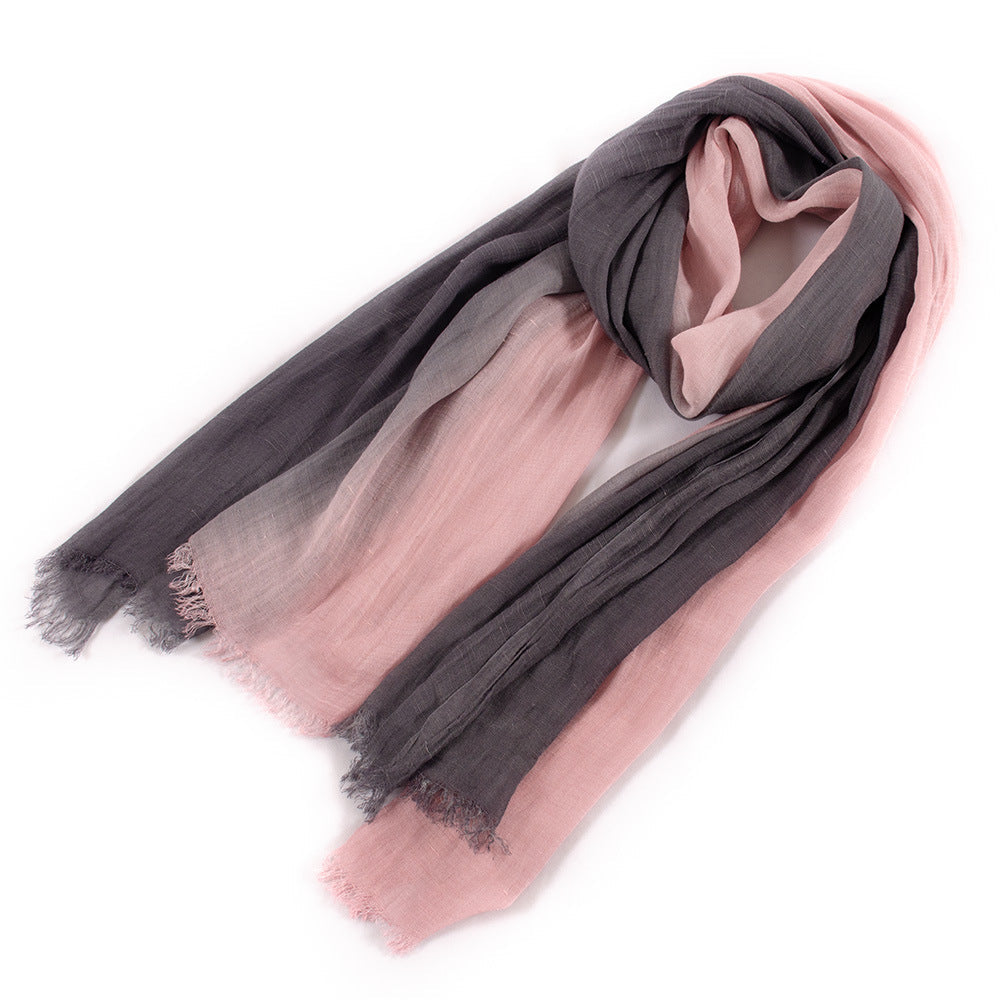 Large soft warm cotton tassel scarf with fringed edges, folded to show its textured fabric