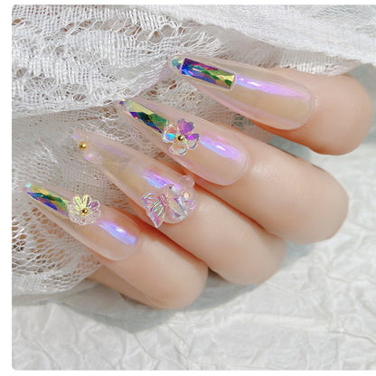 Flower butterfly nail art design close-up in pink and white floral detail