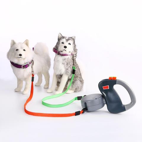 Retractable dual pet dog walking leash with two extendable leads and ergonomic handle