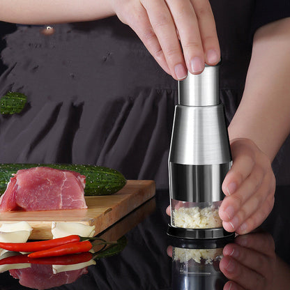 Manual garlic crusher and onion chopper with press-style squeezer for vegetables and kitchen prep