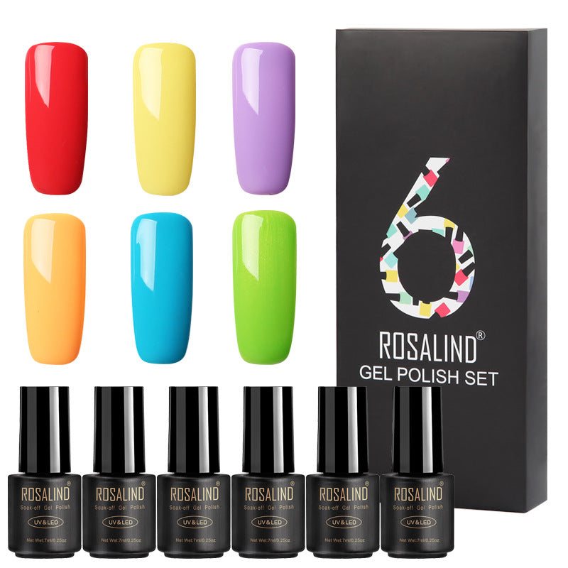 Six bottles of Fine nail polish in assorted colors displayed together