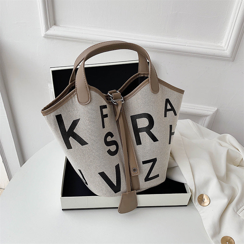Women's letter printed canvas tote bag by BACKUPMYFILESNOW® featuring a stylish design and spacious interior.