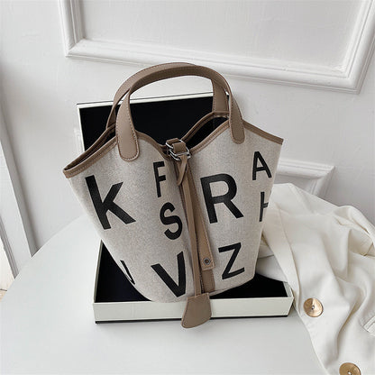 Women's letter printed canvas tote bag by BACKUPMYFILESNOW® featuring a stylish design and spacious interior.