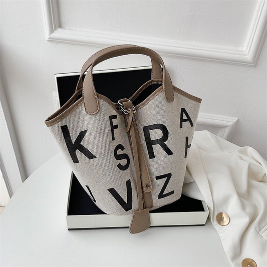 Women's letter printed canvas tote bag by BACKUPMYFILESNOW® featuring a stylish design and spacious interior.
