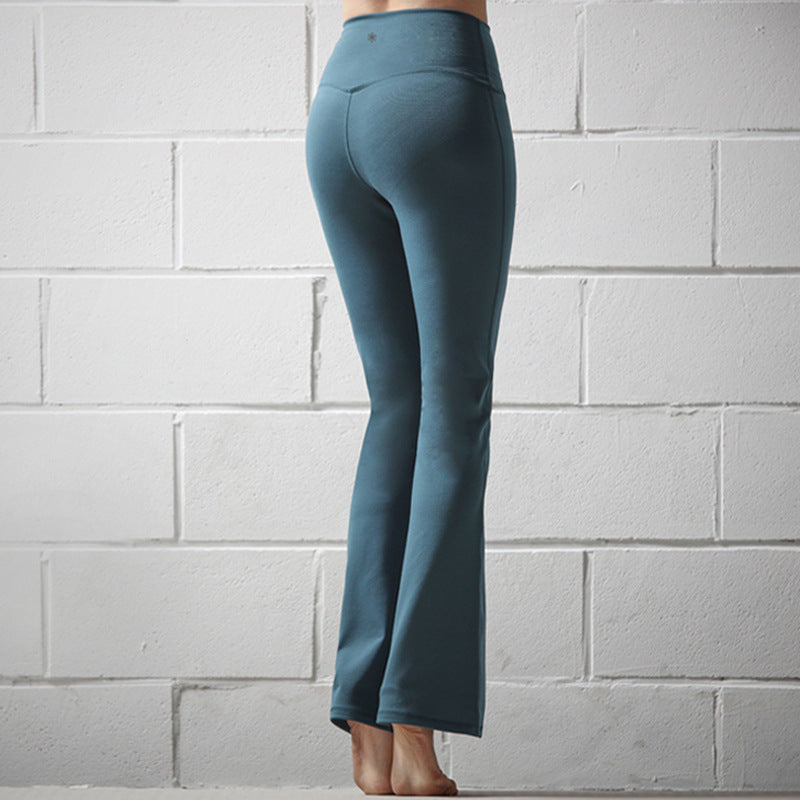 Yoga trumpet pants in a flared silhouette, displayed against a clean background