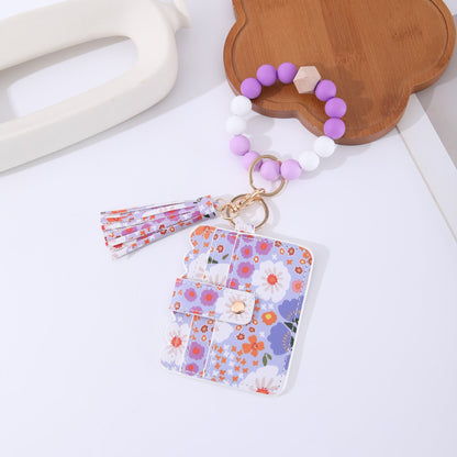 Printed leather wallet keychain for women, compact wallet with attached key ring and colorful pattern