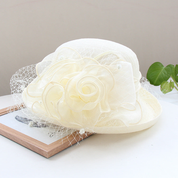 Banquet flower top hat with curled brim, decorative flowers, and structured sun hat design