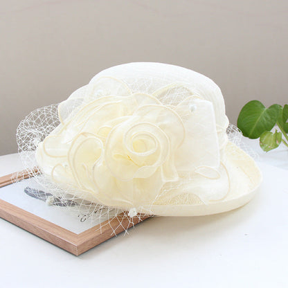 Banquet flower top hat with curled brim, decorative flowers, and structured sun hat design