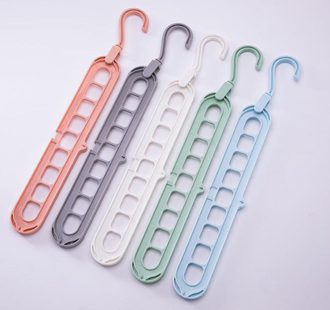 9-hole clothes hanger organizer, space-saving hanger in white plastic with multiple slots for vertical storage