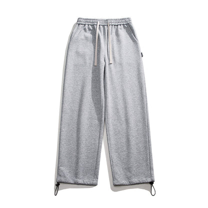 Drawstring ankle-tied loose straight sweatpants in a relaxed fit, shown in detail