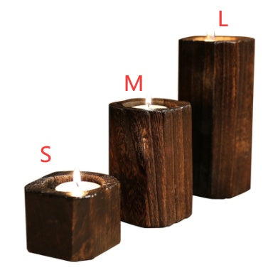 Solid wood candle holder with a natural finish, shown from the front