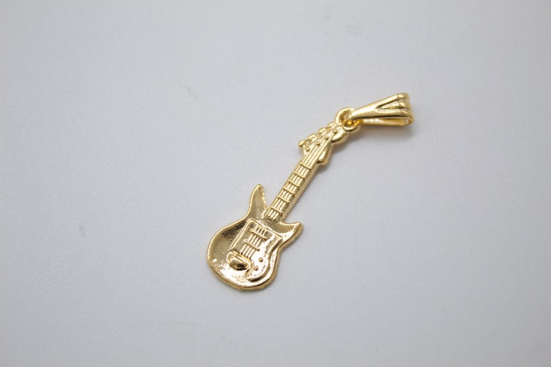 18K gold filled bass electric guitar pendant by MIA Jewelry, showcasing a detailed mini guitar with shiny gold finish.