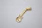 18K gold filled bass electric guitar pendant by MIA Jewelry, showcasing a detailed mini guitar with shiny gold finish.