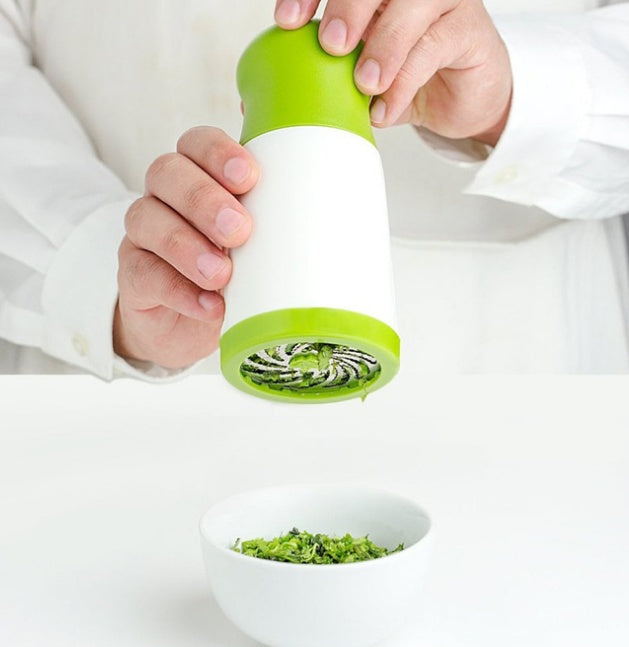 Herb grinder spice mill and parsley shredder chopper in compact metal design