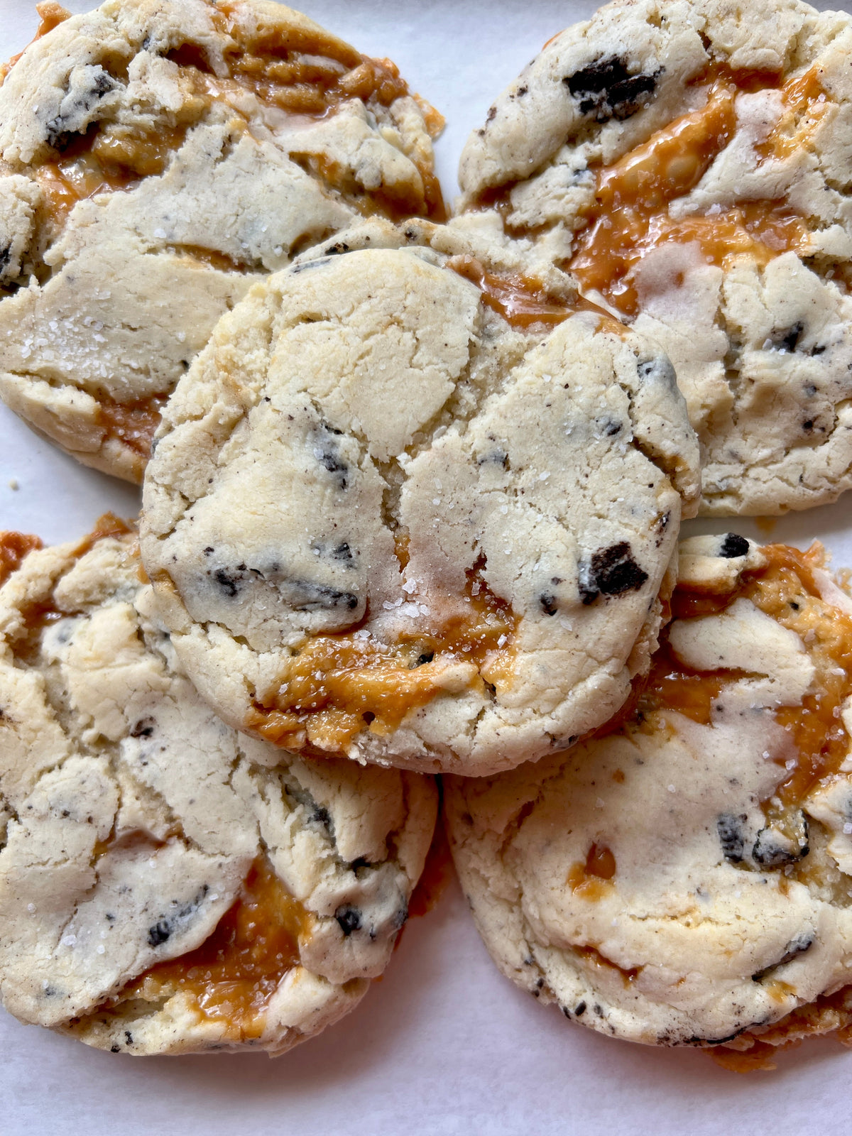 Chocolate chip cookies from Let's Get Baked Artisan Desserts, featuring a salty sweet flavor and golden-brown baked appearance.