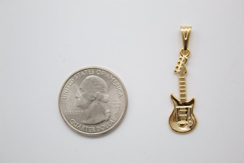 18K gold-filled bass electric guitar pendant by MIA Jewelry, detailed close-up showing the pendant's design and gold finish.