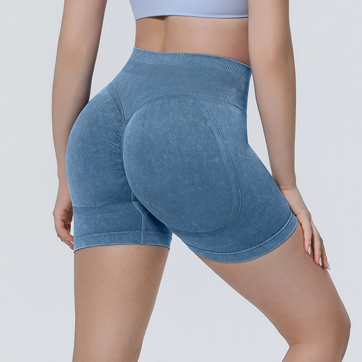 Seamless knitted sand-washed yoga shorts in a close-up product view