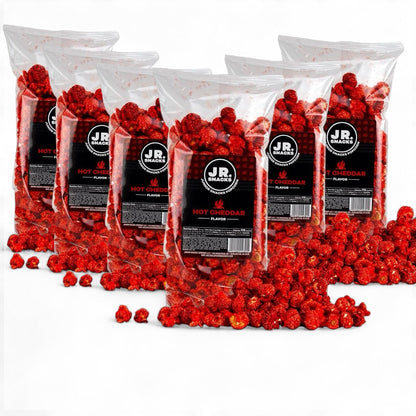 Junior Snacks Co. Hot Cheddar snack bag featuring spicy cheddar-flavored chips in colorful packaging.
