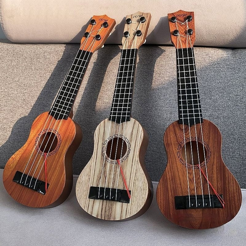 Colorful ukulele guitar musical instrument toy with four strings and compact wooden body