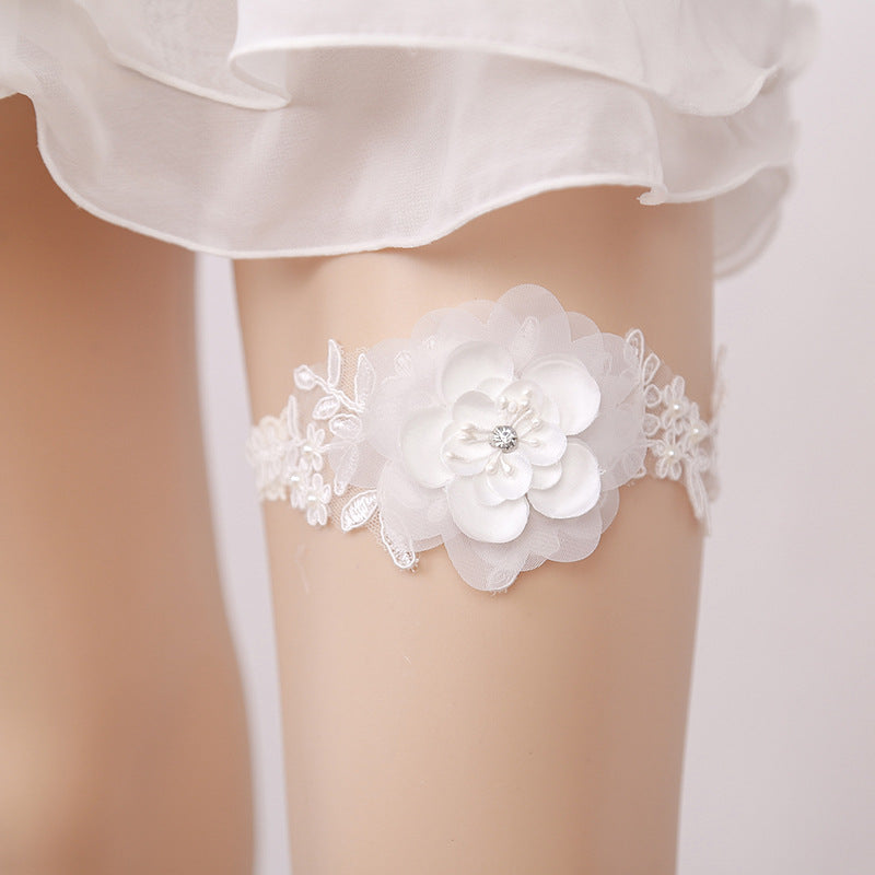 Western-style wedding garter elastic leg ring close-up, featuring decorative design for bridal wear
