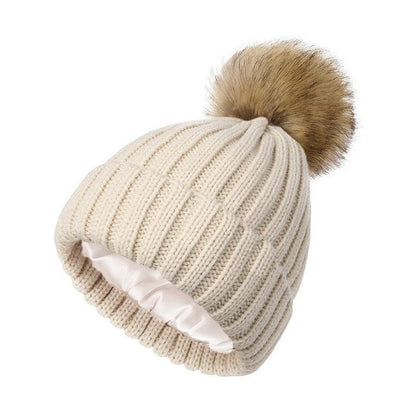 Women's solid-color brimmed hat with satin pom-pom