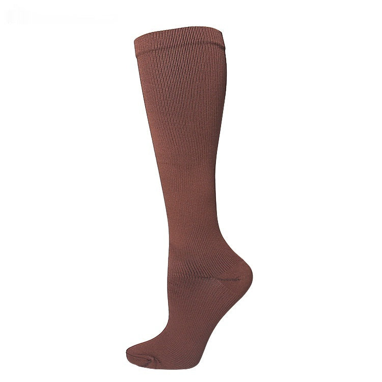 Women's calf-length compression socks in black, featuring a snug supportive fit