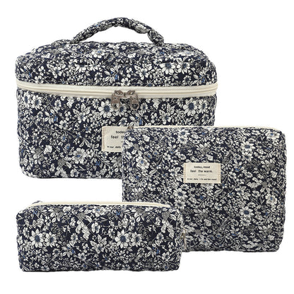 Floral home storage cosmetic bag with a colorful botanical pattern and zippered top, shown against a plain background
