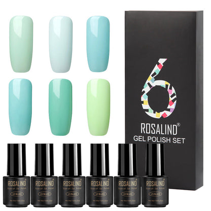 Six bottles of Fine nail polish in assorted colors displayed together