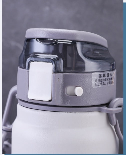 Insulated steel water flask by BACKUPMYFILESNOW® with large volume, silver finish, and secure lid for hot and cold beverages.