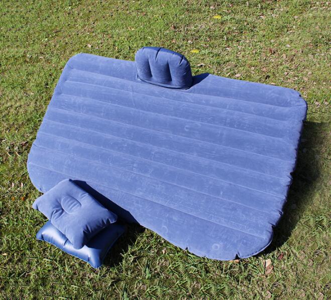 Car inflatable bed with cushioned sleeping surface and raised side bolsters for in-vehicle rest