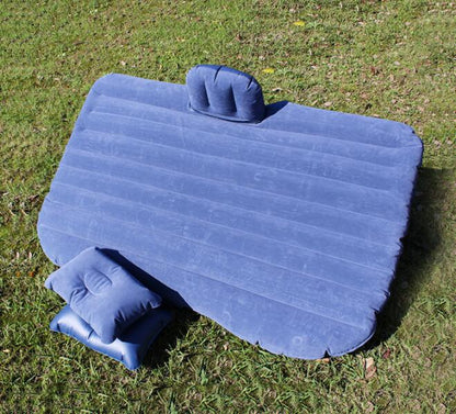Car inflatable bed with cushioned sleeping surface and raised side bolsters for in-vehicle rest