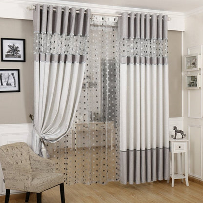 Simple blackout curtains in a solid design, shown hanging over a window