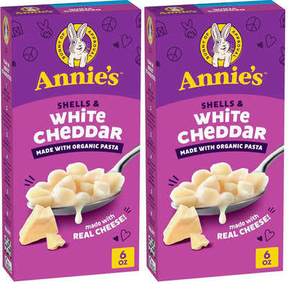 Annie's Homegrown organic shells and white cheddar mac and cheese pack with four 24-ounce boxes on a white background.