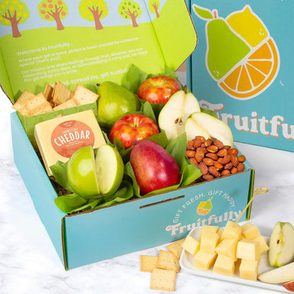 Fresh fruit gift basket from A Gift Inside featuring mixed fruit, cheese, and olive oil crackers for special occasions.