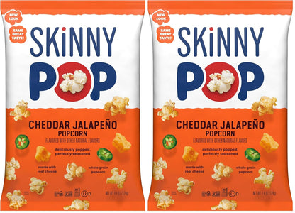 BACKUPMYFILESNOW® SkinnyPop White Cheddar gluten-free popcorn in an 8 oz bag, showing a close-up of the snack with white cheddar flavor.