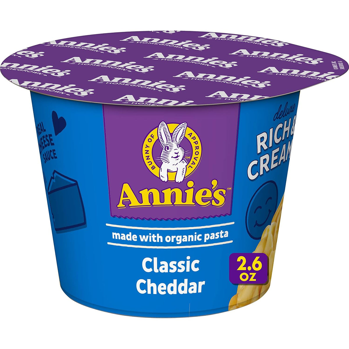 Annie's Homegrown White Cheddar Mac & Cheese microwavable cups, 8-pack, showing creamy cheese sauce and pasta in a cup.