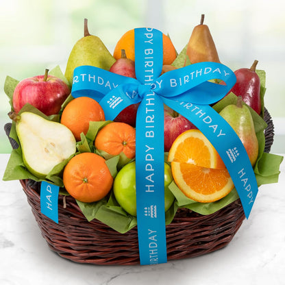 Fresh fruit gift basket by A Gift Inside with pears, apples, kiwi, and navel oranges, decorated with a happy birthday ribbon.