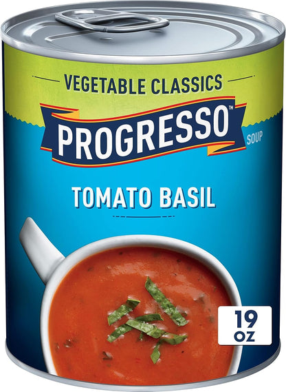 Canned Progresso Traditional Chicken Noodle Soup in 19 oz cans, four-pack, showing labels and soup inside the cans.