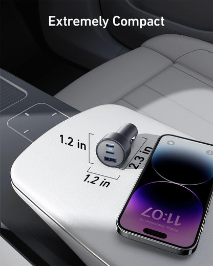 Anker 535 67W car charger with dual USB ports plugged into a vehicle's dashboard for fast charging devices.
