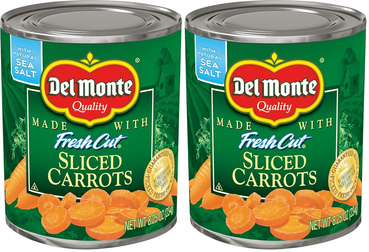 Cans of Del Monte sliced carrots in a pack of 12, showing the prepackaged orange carrots inside the labeled cans.