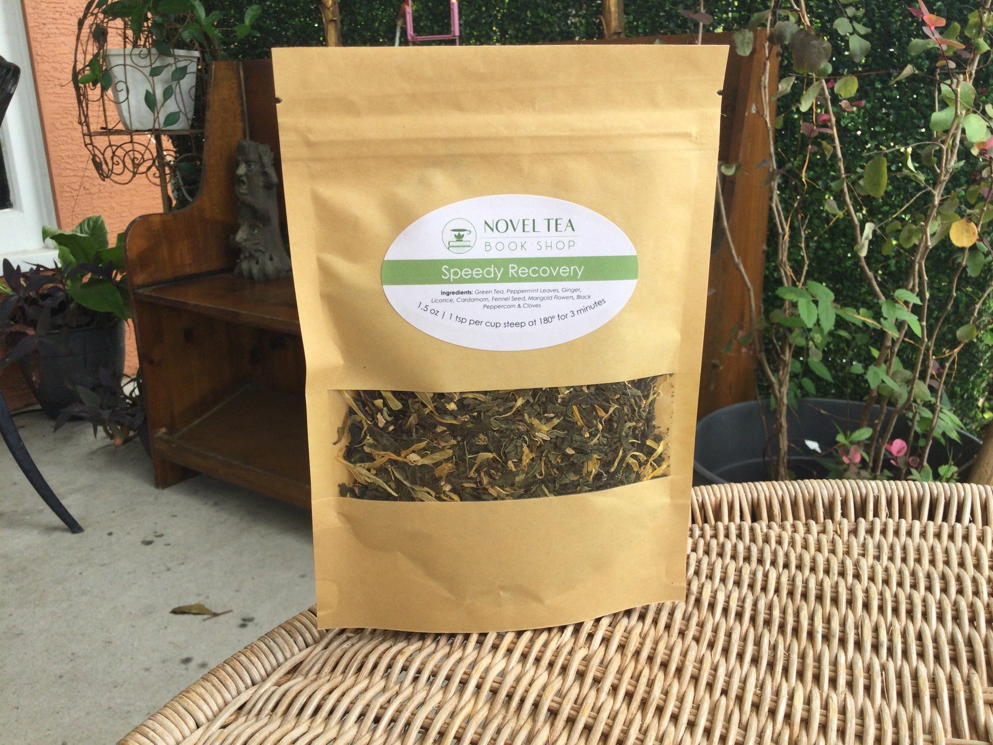 Loose leaf wellness tea from Novel Tea Book Shop called Speedy Recovery, featuring dried herbs and tea leaves in a clear jar.