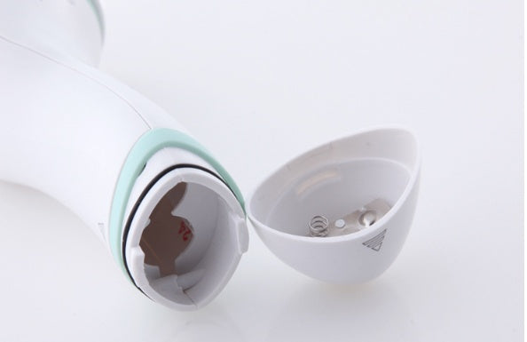 Electric waterproof facial cleansing brush for gentle skin cleaning, shown in a compact handheld design
