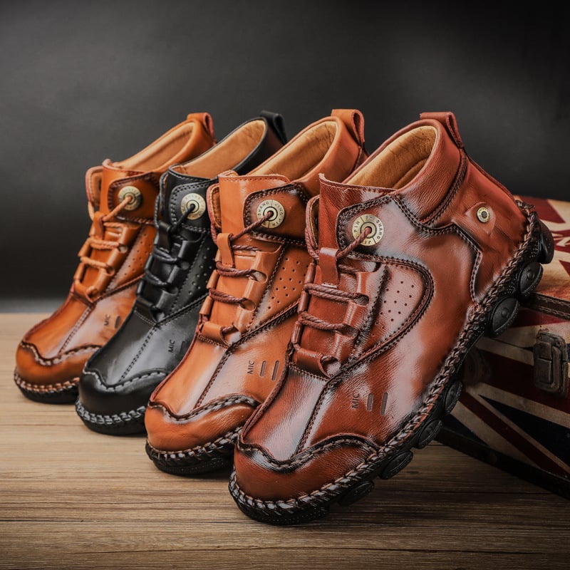 Chic high-top leather grip shoes by BACKUPMYFILESNOW® featuring sleek design and sturdy soles on a neutral background.
