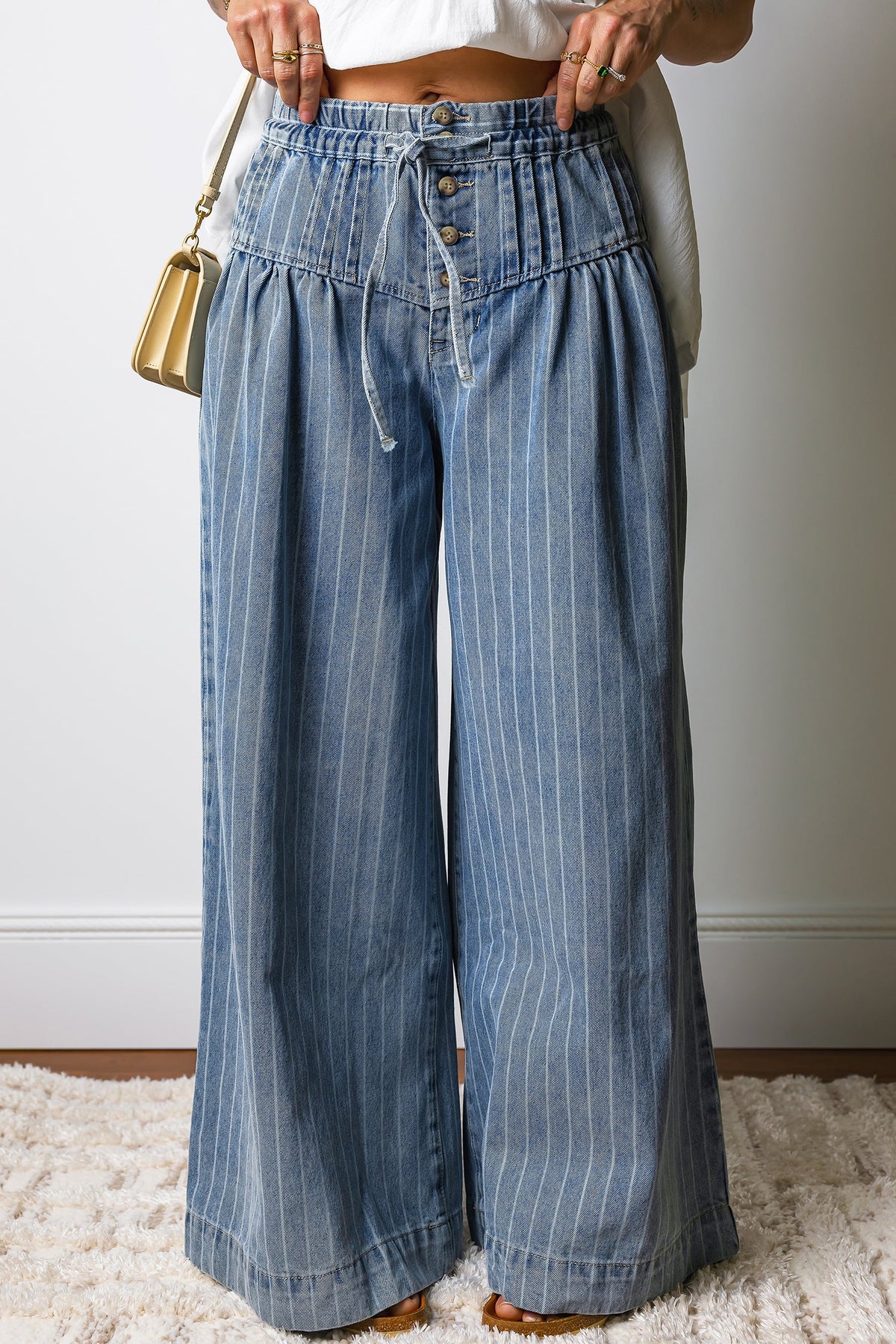 Light blue Sutton casual wide-leg jeans by Threaded Pear with relaxed fit and classic denim styling.